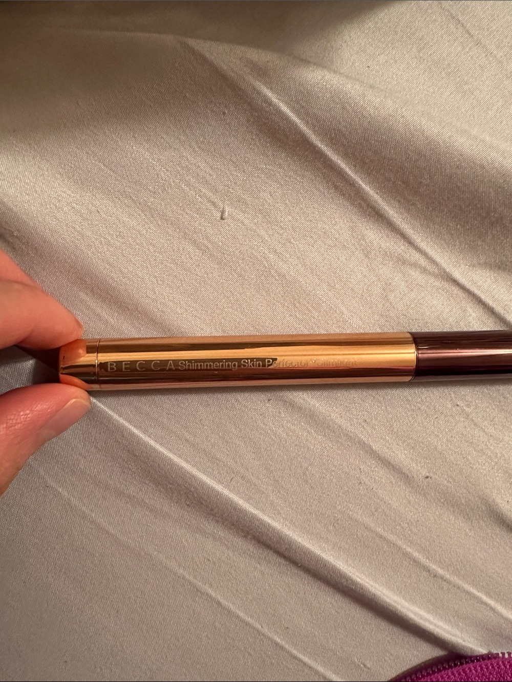 BECCA Shimmering Skin Highlighter Stick in Champagne Pop. No box.
